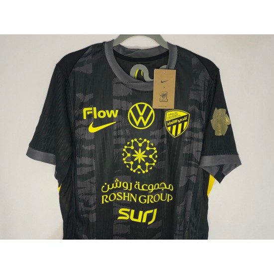 Al-Ittihad black jersey with the Golden League logo + a free Al-Ittihad logo sticker.